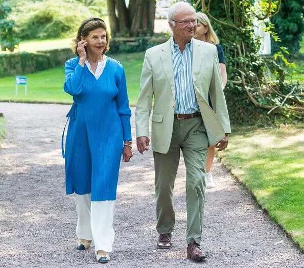 Queen Silvia wore a blue long cardigan from Issey Miyake. Pleats Please Issey Miyake long cardigan. Crown Princess Victoria and Princess Sofia