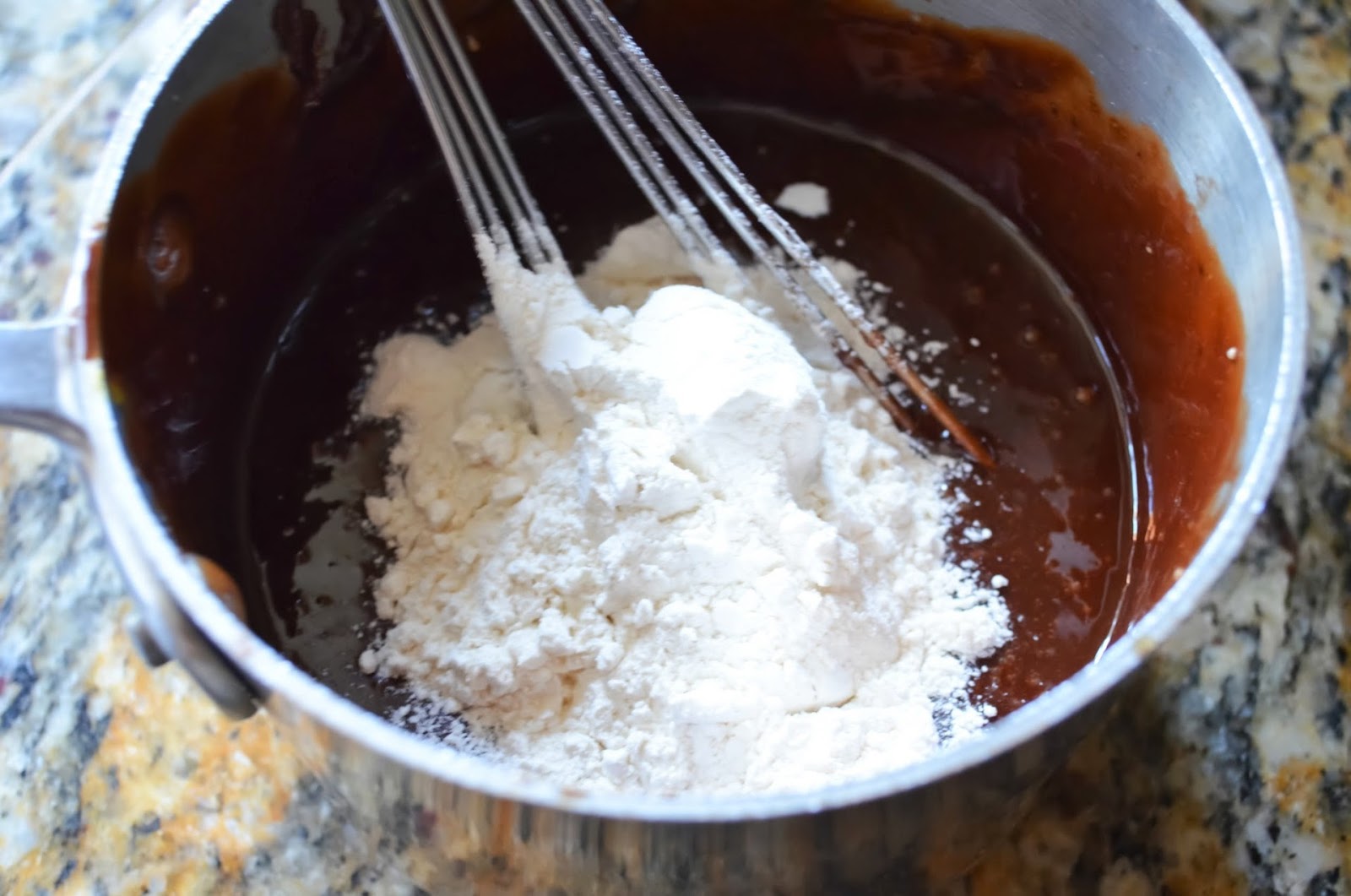 Flour add to Molten Chocolate Lava Cake Batter.