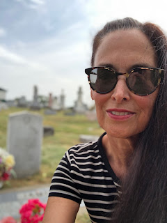woman with sunglasses in a cemetery