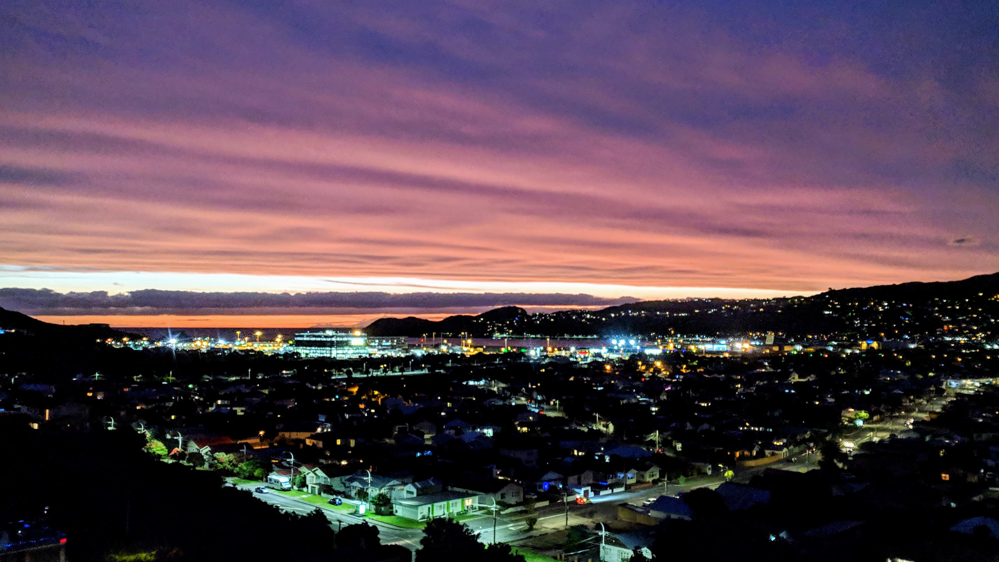 Summer sunset over Wellington airport and out across the Strait