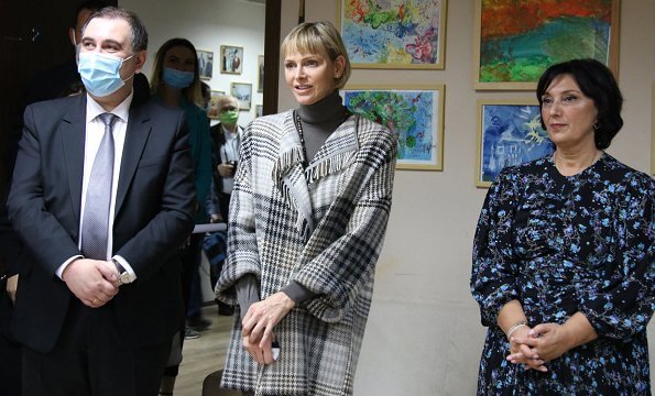 Princess Charlene visited the Olympic Village in Tbilisi and its sports facilities. Charlene wore a traford plaid fringe poncho from Loro Piana