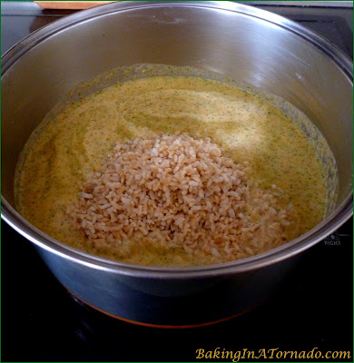 Creamy Vegetable Rice Soup is a cold weather staple. This hearty soup is made with fresh vegetables and brown rice, perfect for a warming winter lunch or dinner. | Recipe developed by www.BakingInATornado.com | #recipe #soup