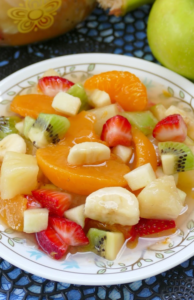 This super easy tropical fruit salad is great for breakfast, snack or dessert! Peaches, pineapple, strawberries, kiwi, oranges, banana and apples give this salad a wonderful flavor. We love serving it at parties, picnics, holidays and BBQ's!