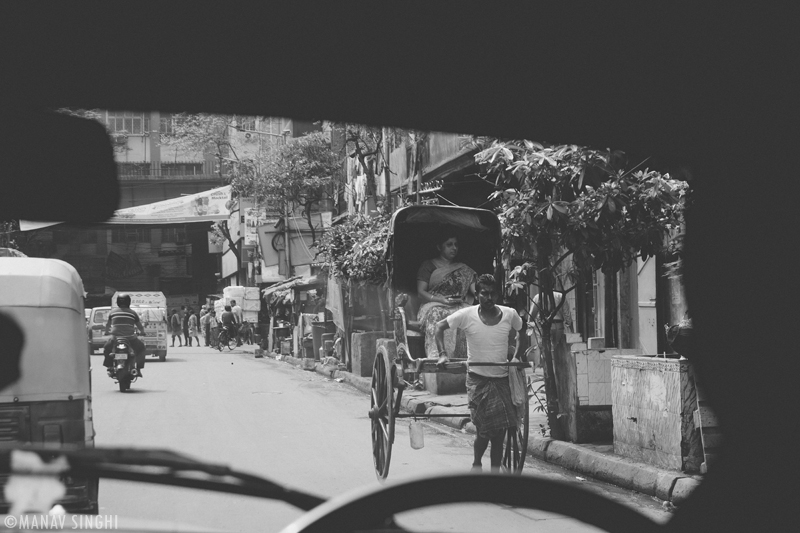 Hand Pulled Rickshaw (Hath Rickshaw) The Picture was taken near Howrah Bridge, Kolkata.