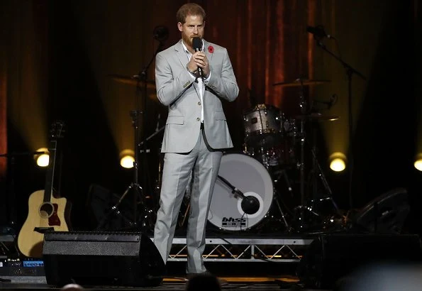 Meghan Markle wore Antonio Berardi Tuxedo dress, Aquazzura Casablanca peach suede pumps and she carried Cuyana Saddle bag