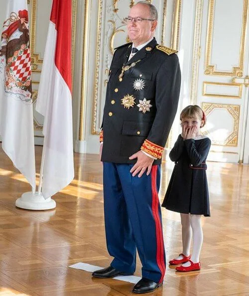 Princess Charlene wore a coat from Terrence Bray. Gabriella wore a dress from Jacadi
