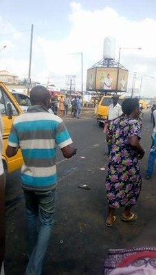 2 Photos/Video: Bread seller knocked down and killed by commercial bus at Sango Toll Gate