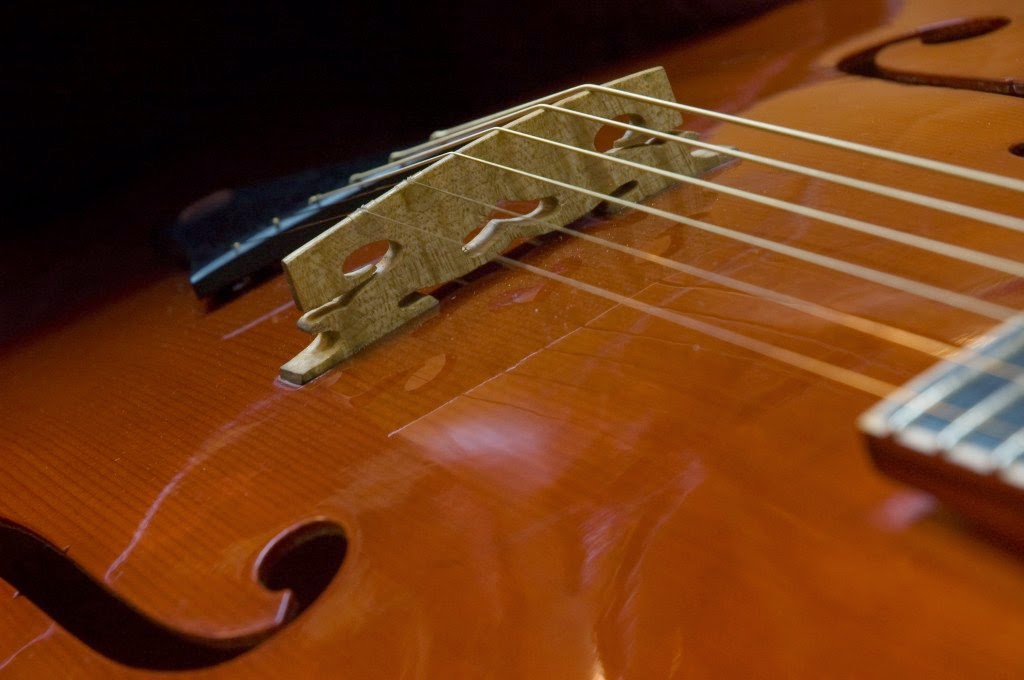 Falk Guitars and Mandolins Blog One Piece Archtop Guitar Bridge
