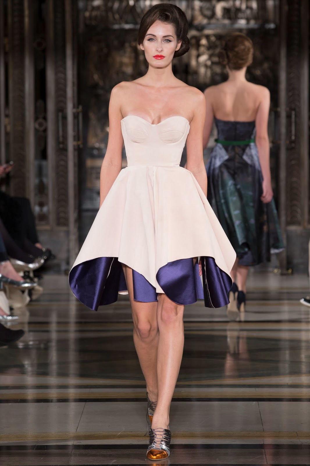 In true Ursula style, bustier dresses graced the catwalk. Full skirts ...