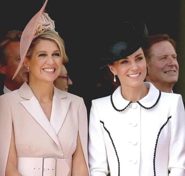 The Duchess is wearing Catherine Walker. Queen Maxima is wearing Claes Iversen. Queen Letizia wore a printed midi dress by Cherubina