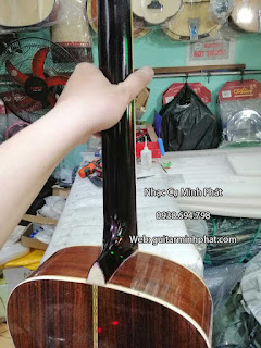 Địa chỉ thay dây đàn, chỉnh rè, dán thùng đàn guitar tphcm