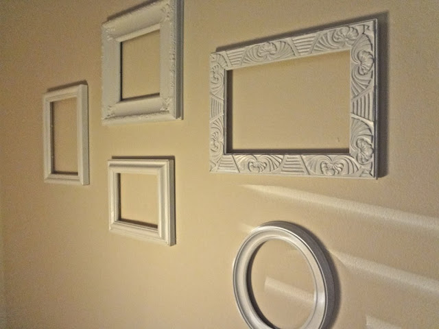 five empty picture frames used as wall art