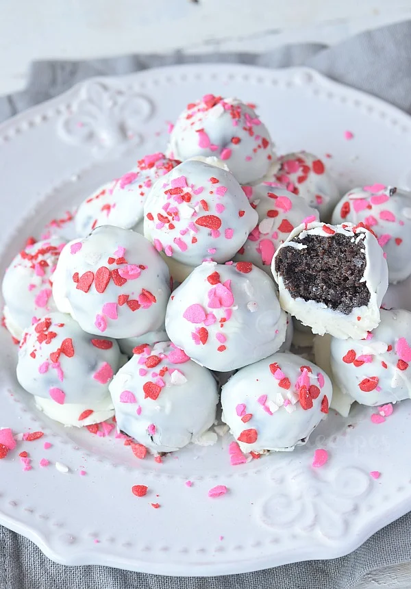a white plate with oreo peppermint cookie balls