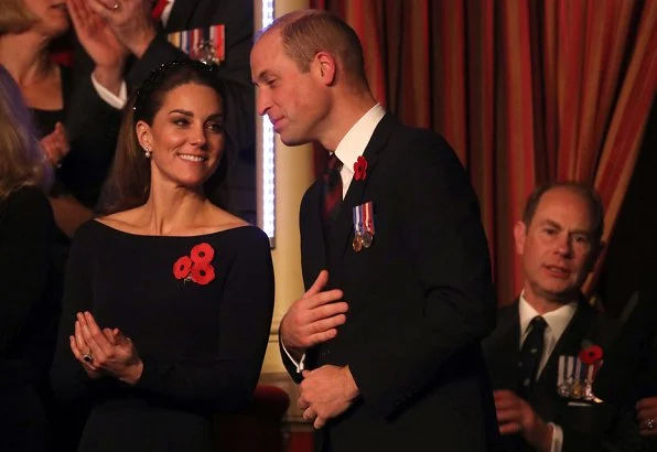 Meghan Markle is wearing Jessica McCormack Gypset Ruby hoop earrings. Queen Elizabeth, Kate Middleton, Prince William, Prince Harry