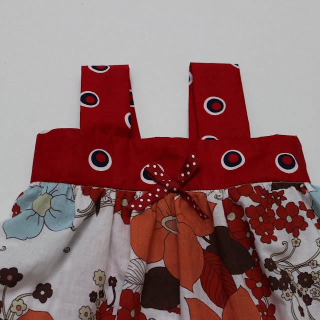 Make a small bow out of a small coordinating scrap of grosgrain ribbon