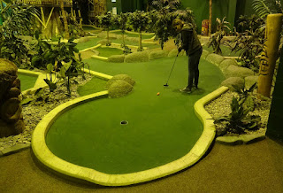 Emily playing at Paradise Island Adventure Golf in the Trafford Centre, Manchester