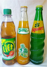 Three soda bottles with labels that read Lift Boing! Squirt