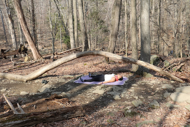 practicing savasana outdoors