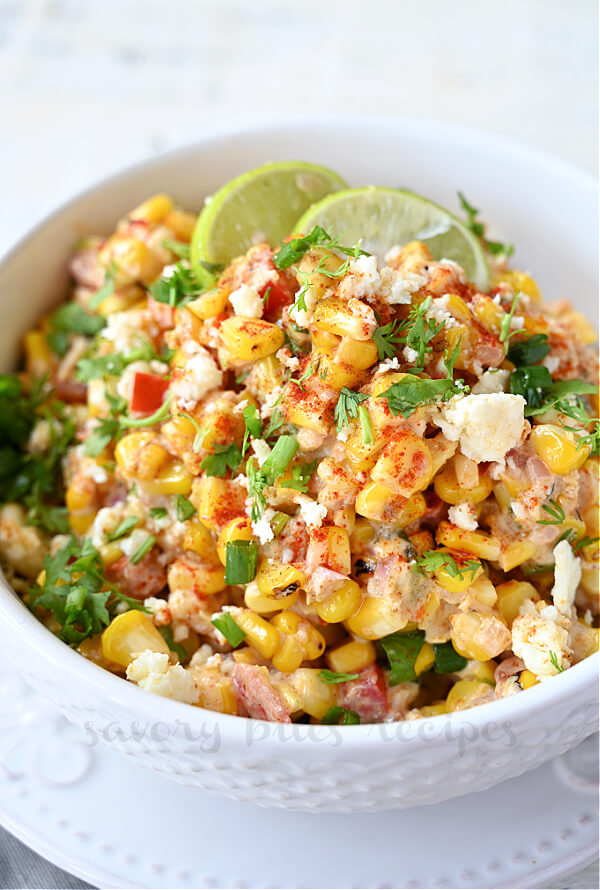 a closer look at bowl with best mexican grilled street corn salad with cotija and lemon