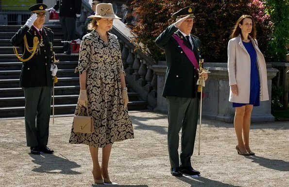 Prime Minister Sophie Wilmes. Queen wore a patterned coatdress by Armani, Natan, Dries Van Noten, Diane Von Furstenberg