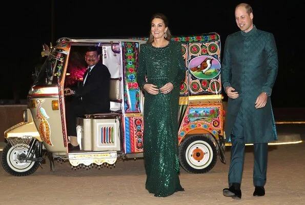 Kate Middleton wore a sparkling emerald green gown by Jenny Packham, and earrings by O'nita. Prince William wore a traditional Sherwani by Naushemian