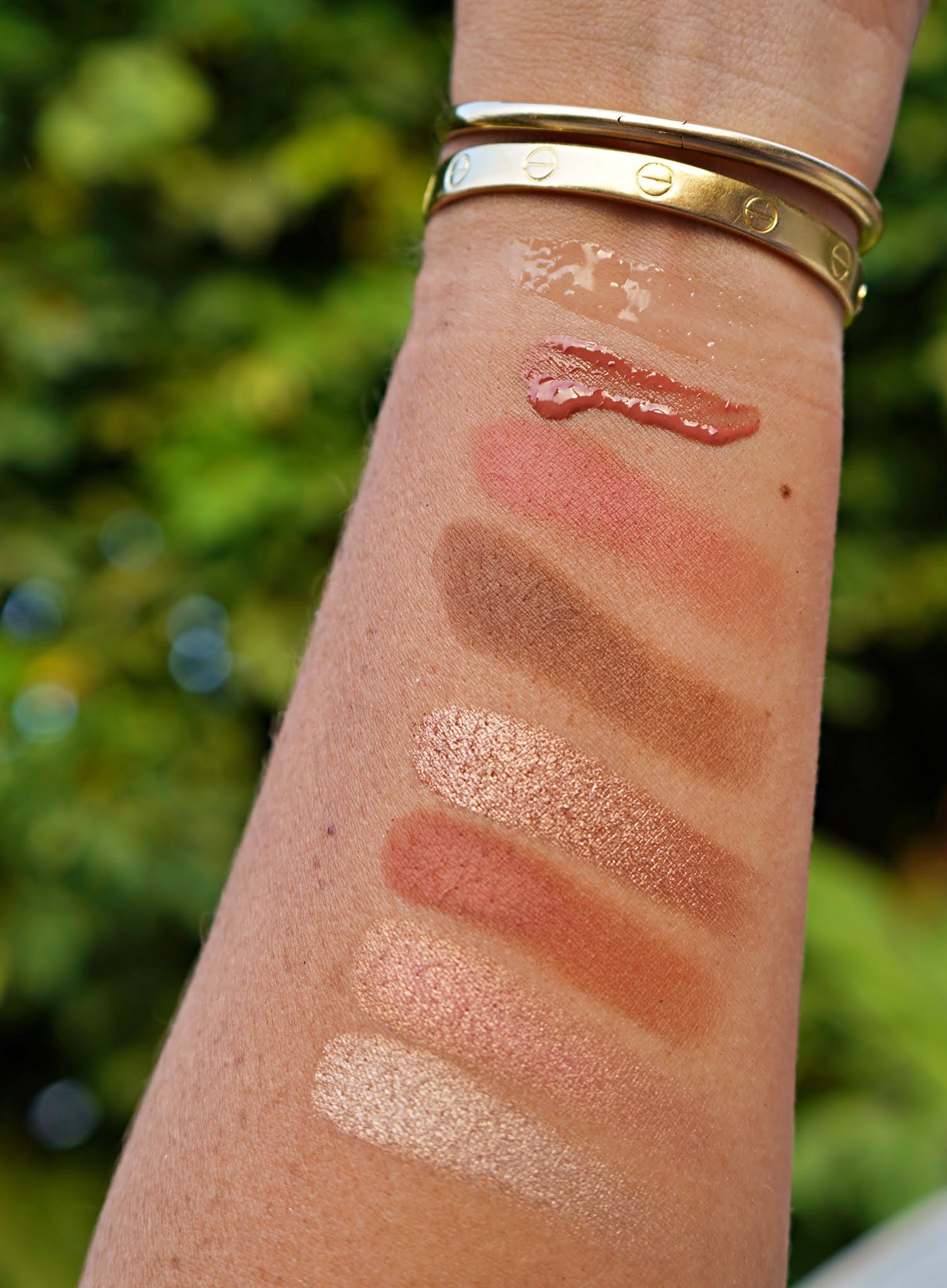 Swatches of the *EM Cosmetics Starlight Glow Trio in outdoor lighting.