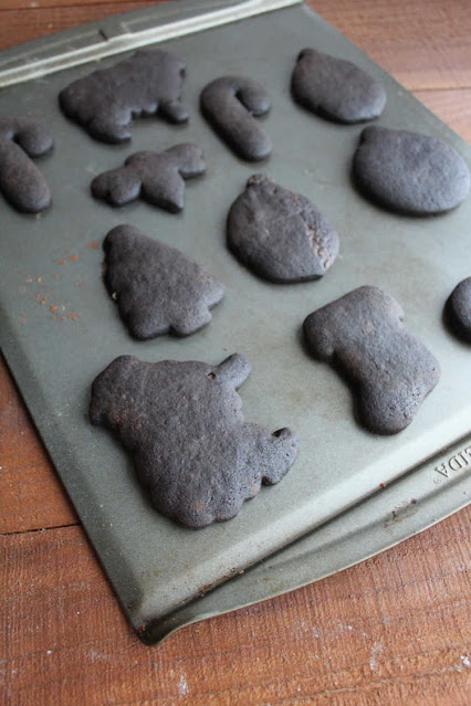These chocolate cookies have a deep dark color, great chocolate flavor and are perfect for rolling out and cutting into shapes. Your decorated cookie game just went to the next level! black cookies cut into fun shapes on sheet pan