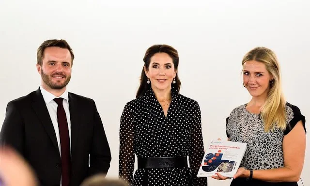 Crown Princess Mary wore a polka dot silk shirt dress from Carolina Herrera. Dulong Fine Jewelry pearl earrings