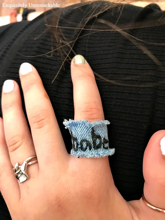 Denim Ring embroidered with word BABE on hand