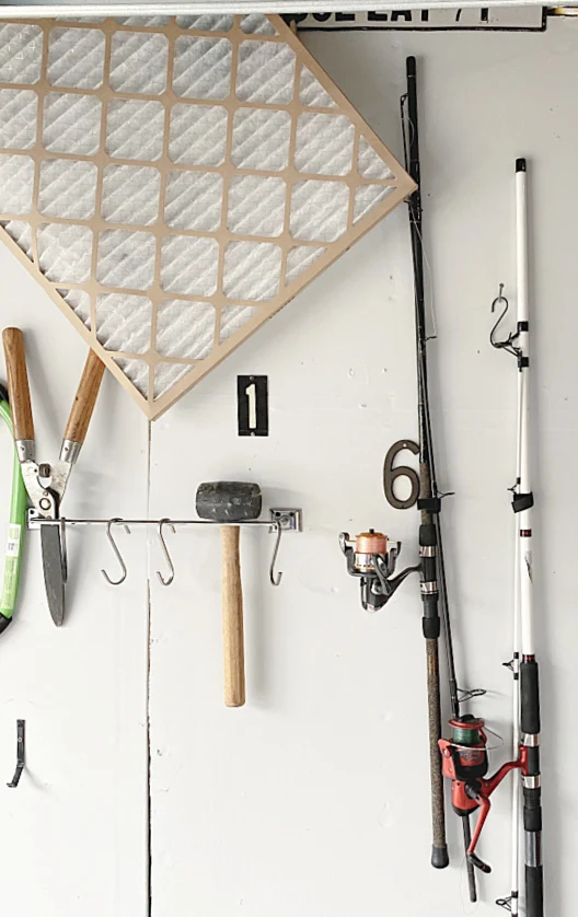 tools and fishing pole organization