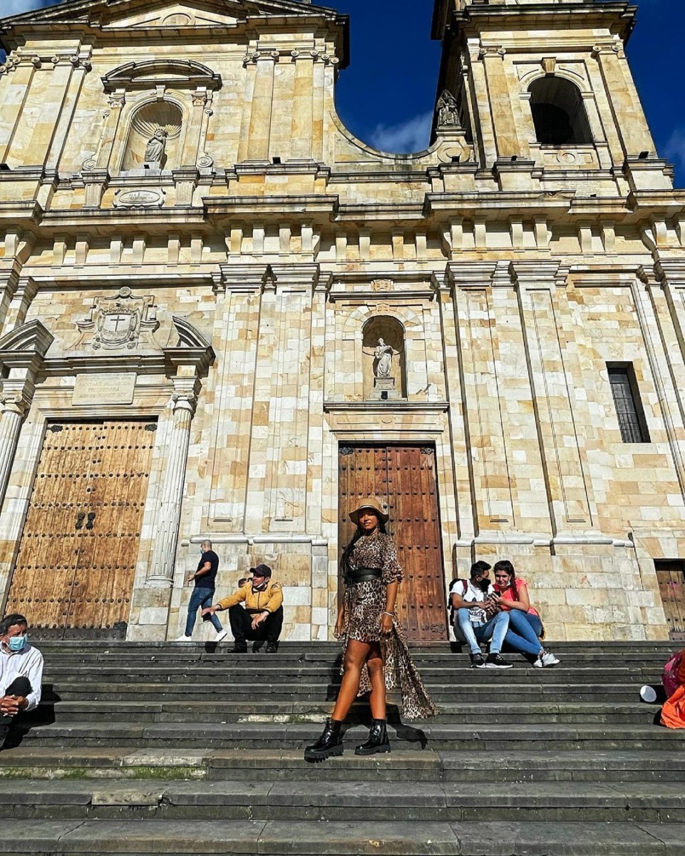 Maureen Waititu taking a picture at Bolivar Square (Plaza de Bolívar de Bogotá).