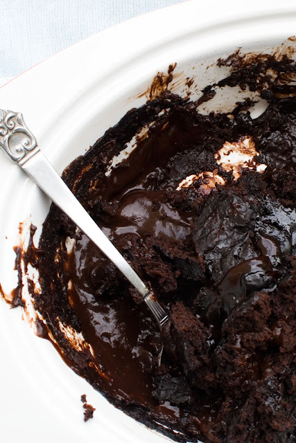 Chocolate self-saucing pudding with a portion removed