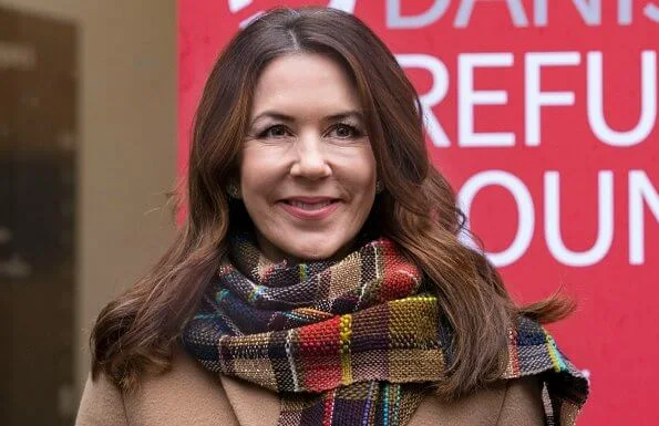 Crown Princess Mary wore a flared long coat from Max Mara, and black silk shirt. Handmade scarf crocheted-rainbow colors scarf