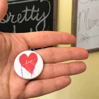 Messy Neon Heart Magnet in a hand