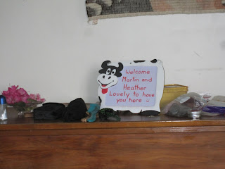 Picture of a cow-shaped whiteboard saying "Welcome Martin and Heather - Lovely to have you here"