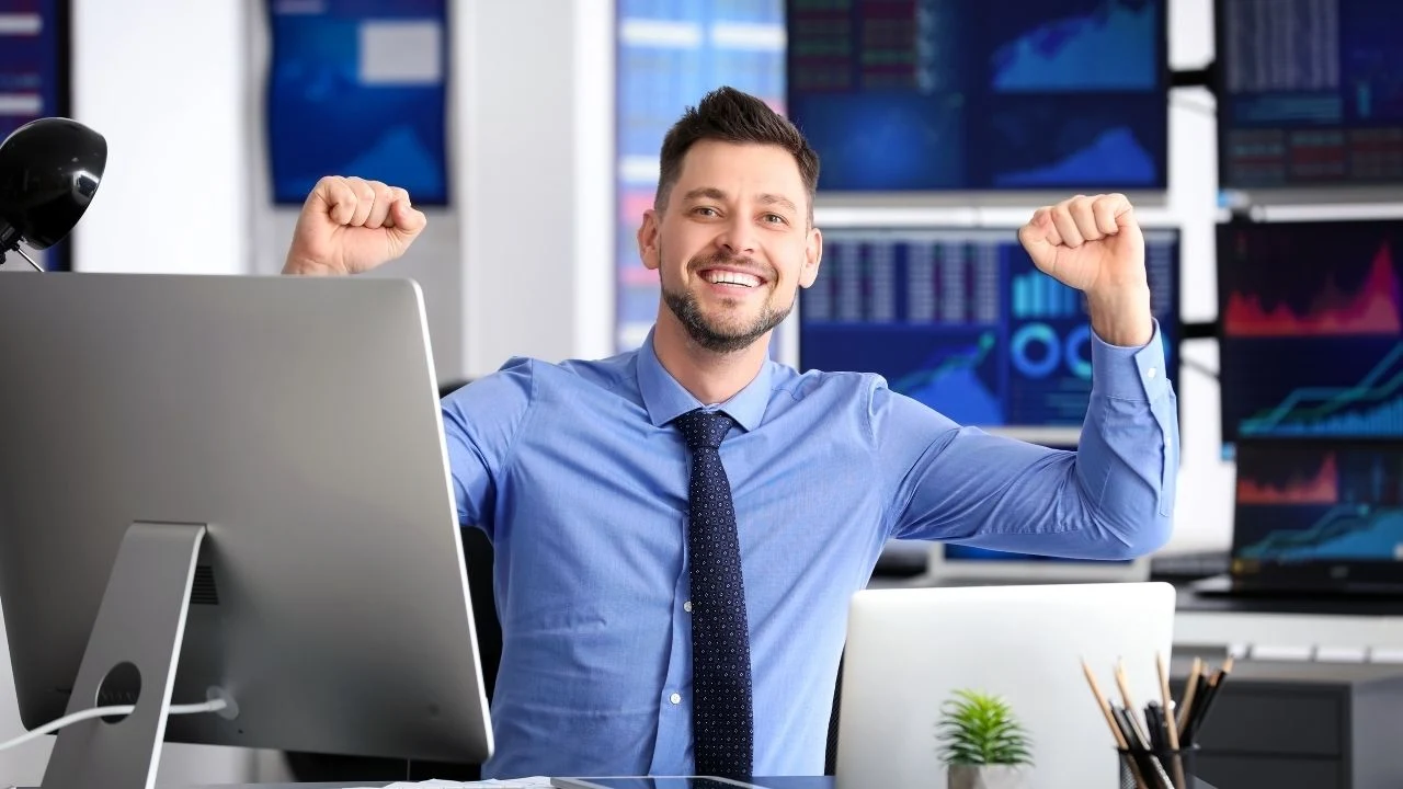 Young stock exchange trader working in the office.