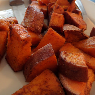 Bite-sized chunks of sweet potato tossed in coconut oil, cumin, and cinnamon.  Then baked until crispy and soft.