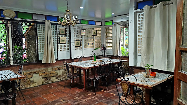Kezia Romblon sits inside the pretty interior of Hapag Vicenticos
