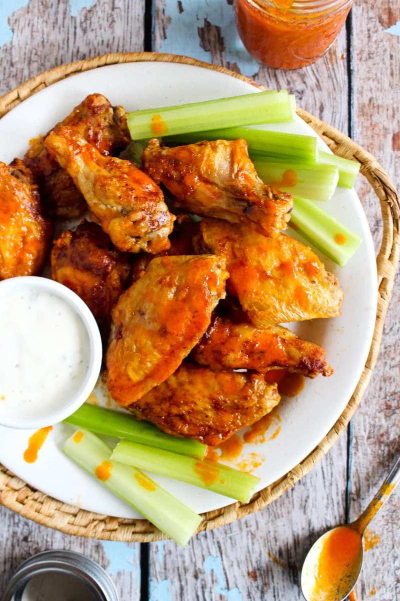 Air Fryer Buffalo Wings are air fried until super crsipy, then tossed in a spicy homemade buffalo sauce. They are the best buffalo wings ever! #airfryer #buffalowings