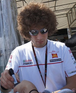 Marco Simonelli in 2010, busy signing  autographs for his many fans