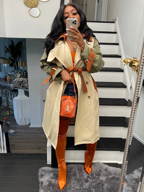 A fashion contrast color trench long coat.