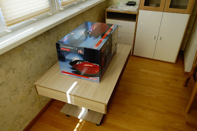Miele SGDA3 Complete C3 Mango/Red PowerLine in a box on a table