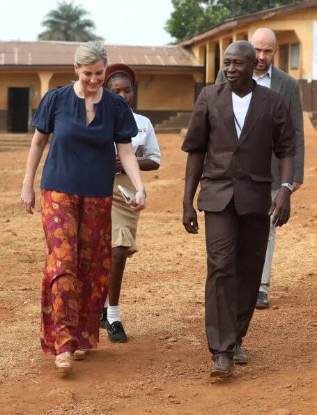 The Countess of Wessex visited Russell Technical School in Sierra Leone and visited Tombo Health Clinic. floral print trousers