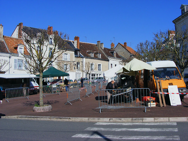 Outdoor farmers market during Covid19 lockdown.  Indre et Loire, France. Photographed by Susan Walter. Tour the Loire Valley with a classic car and a private guide.