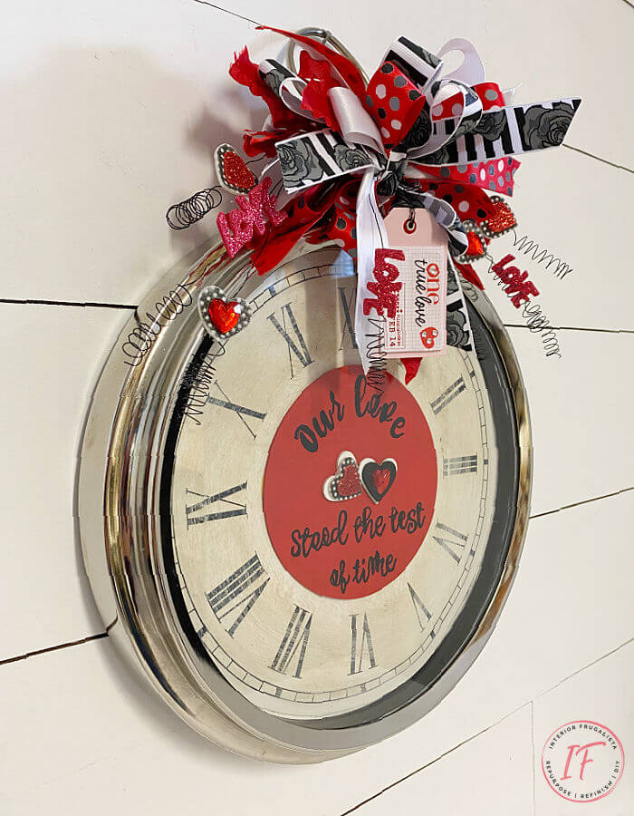 How to repurpose an old  wall clock and turn it into a whimsical DIY Valentines wreath. It's a fun, cheap, and unique door wreath idea.