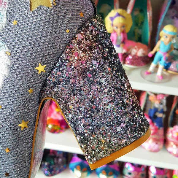 close up of 4 inch glitter heel on ankle boot