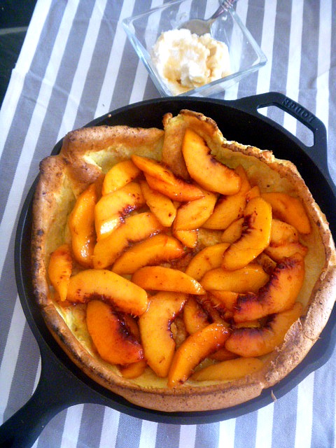 A showstopper presentation is made when you serve this deliciously light and fluffy Dutch Baby filled with juicy ripe peaches at your next breakfast or brunch! - Slice of Southern