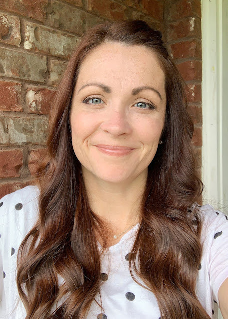 Woman with brown hair and polka dot shirt.  She's Crafty.