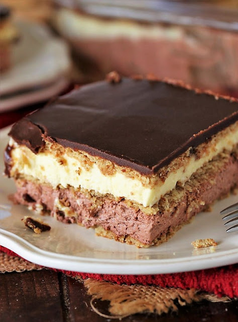 Layers of Pudding in Vanilla & Chocolate No-Bake Eclair Dessert Image