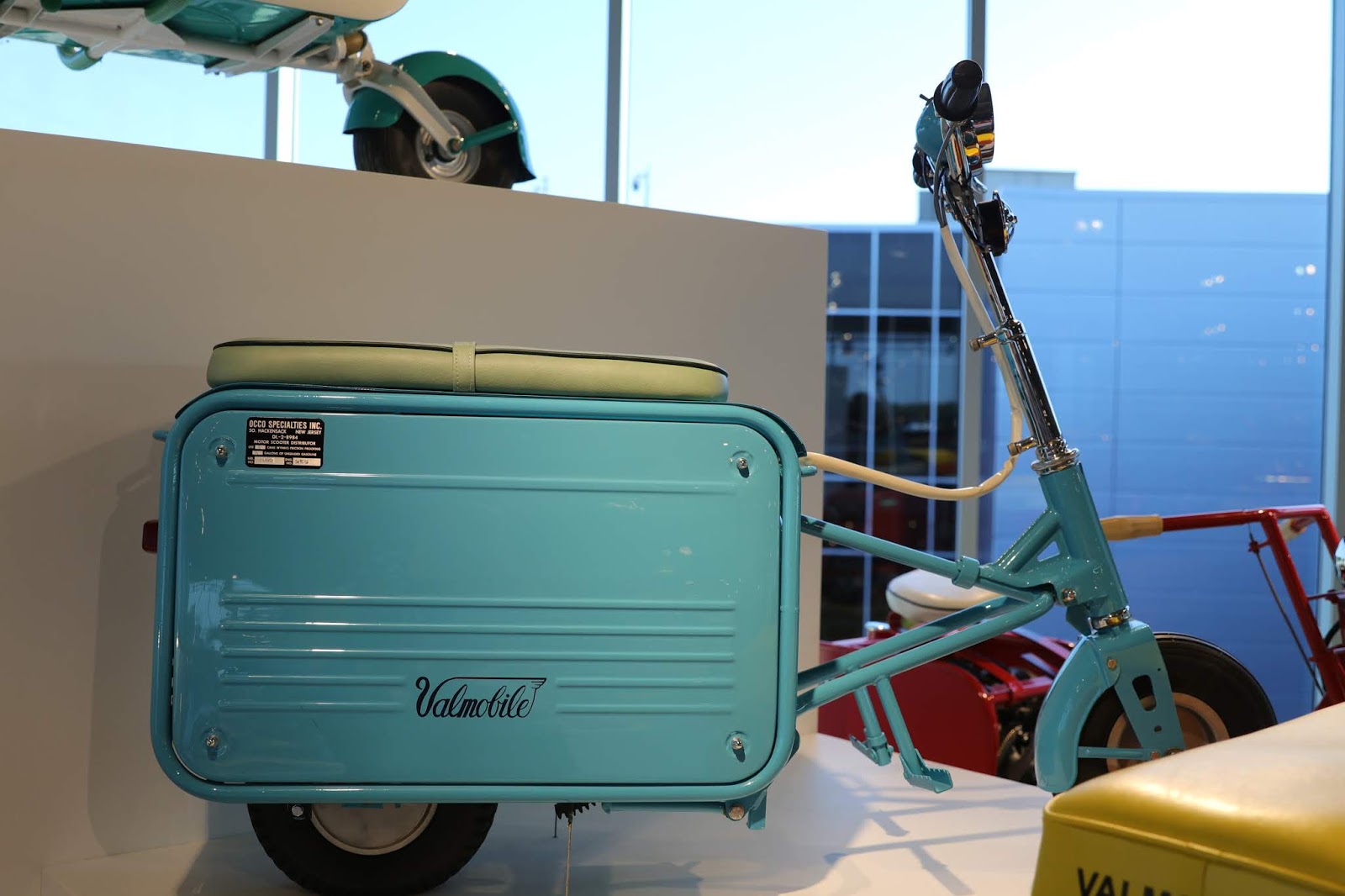 OldMotoDude Valmobile FoldUp Scooters on display at the Barber